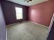 Bedroom with window, carpeted floor, and colorful walls at 261 Punkin Ct, Greenfield, IN 46140