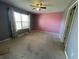 Bedroom with window, carpeted floor, and colorful walls at 261 Punkin Ct, Greenfield, IN 46140