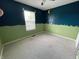 Bedroom with window, carpeted floor, and colorful walls at 261 Punkin Ct, Greenfield, IN 46140