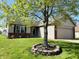 Charming single-story home features a well-maintained lawn, brick accents, and an attached two-car garage at 261 Punkin Ct, Greenfield, IN 46140