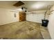 Two-car garage with ample space, storage shelving, and an automatic door opener at 261 Punkin Ct, Greenfield, IN 46140