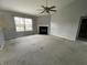 Cozy living room with fireplace and ceiling fan at 261 Punkin Ct, Greenfield, IN 46140