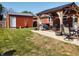 Inviting backyard with covered patio, outdoor seating, and storage shed for relaxing and entertaining at 2630 Wedgewood Dr, Columbus, IN 47203