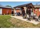 Beautiful backyard features a covered patio with outdoor furniture, perfect for enjoying outdoor living at 2630 Wedgewood Dr, Columbus, IN 47203