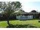 Backyard featuring a white picket fence creating a serene outdoor space with a tree at 2630 Wedgewood Dr, Columbus, IN 47203