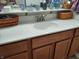 Bathroom vanity with a white countertop and wood cabinets at 2630 Wedgewood Dr, Columbus, IN 47203