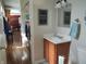 Bathroom with a laundry area and a view to the kitchen and dining area at 2630 Wedgewood Dr, Columbus, IN 47203