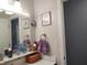 Bathroom vanity with a clock on the wall at 2630 Wedgewood Dr, Columbus, IN 47203