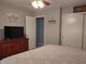 Bright bedroom with a bed, dresser with TV, and closet space at 2630 Wedgewood Dr, Columbus, IN 47203