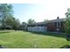 Ranch style house has a well maintained lawn with a white picket fence at 2630 Wedgewood Dr, Columbus, IN 47203