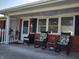 Charming front porch featuring rocking chairs and a view of the home's entrance at 2630 Wedgewood Dr, Columbus, IN 47203