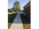 Well-maintained red brick house with a neatly manicured green lawn and a charming white picket fence at 2630 Wedgewood Dr, Columbus, IN 47203