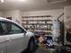 Garage with shelving and a car at 2630 Wedgewood Dr, Columbus, IN 47203