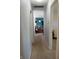 Neutral hallway leads to rooms with colorful decor at 2630 Wedgewood Dr, Columbus, IN 47203