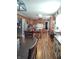 Open kitchen layout featuring stainless steel appliances, an island, and laminate flooring at 2630 Wedgewood Dr, Columbus, IN 47203