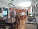 Spacious kitchen with wood cabinets, stainless appliances, decorative accents, and long wood dining table at 2630 Wedgewood Dr, Columbus, IN 47203