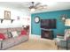 Cozy living room with a ceiling fan, comfortable seating, and decor at 2630 Wedgewood Dr, Columbus, IN 47203