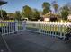 Inviting outdoor patio area with white picket fence and gate for yard access at 2630 Wedgewood Dr, Columbus, IN 47203