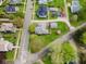 An aerial view of the home showcasing the surrounding neighborhood and its mature trees at 300 E 2Nd St, Sheridan, IN 46069