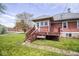 Charming backyard with a wooden deck, perfect for relaxing and enjoying the outdoors at 300 E 2Nd St, Sheridan, IN 46069
