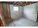 Basement with unfinished walls, a window and exposed framing at 300 E 2Nd St, Sheridan, IN 46069