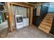 Basement laundry area with washer and dryer next to the stairs at 300 E 2Nd St, Sheridan, IN 46069