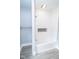 Bathroom with white tiled shower/tub combination and modern fixtures at 300 E 2Nd St, Sheridan, IN 46069