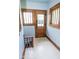 A bright entryway with traditional-style door and trim, plus a glimpse to the basement at 300 E 2Nd St, Sheridan, IN 46069
