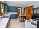 The kitchen shows stainless steel appliances, cabinets, countertops, and natural light at 300 E 2Nd St, Sheridan, IN 46069