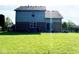 Expansive backyard with well-maintained lawn, patio, and mature trees at 3085 Oakmont Dr, Lapel, IN 46051