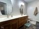 Bathroom with double vanity, wood cabinets and large mirror at 3085 Oakmont Dr, Lapel, IN 46051
