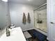 Well-lit bathroom features a glass shower, sleek vanity, and neutral-toned decor at 3085 Oakmont Dr, Lapel, IN 46051