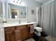 Well-lit bathroom features a wood vanity with a white countertop and a shower-tub combo at 3085 Oakmont Dr, Lapel, IN 46051