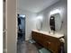 Bathroom with double vanity, wood cabinets and large mirror at 3085 Oakmont Dr, Lapel, IN 46051