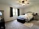 Cozy bedroom with neutral decor, comfortable bedding, and a ceiling fan for a peaceful retreat at 3085 Oakmont Dr, Lapel, IN 46051