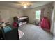 Charming bedroom featuring a playful bunkbed, window, and pink princess decor, perfect for a imagination at 3085 Oakmont Dr, Lapel, IN 46051