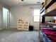 Bright bedroom with bunk beds, a large window, and white dresser on neutral carpet at 3085 Oakmont Dr, Lapel, IN 46051