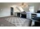 Versatile bonus room offers ample space for a home office or playroom, complemented by neutral decor at 3085 Oakmont Dr, Lapel, IN 46051