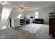 Spacious bonus room with built-in desk, comfortable seating, and ample natural light at 3085 Oakmont Dr, Lapel, IN 46051