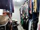 A walk-in closet well stocked with a variety of clothing and shoe options at 3085 Oakmont Dr, Lapel, IN 46051