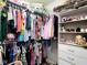 Organized walk-in closet filled with clothing and accessories, maximizing storage space at 3085 Oakmont Dr, Lapel, IN 46051
