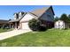 Two-story home with brick and vinyl siding, a two-car garage, and a storage shed at 3085 Oakmont Dr, Lapel, IN 46051