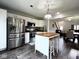 Bright kitchen offers stainless steel appliances, center island and modern finishes at 3085 Oakmont Dr, Lapel, IN 46051