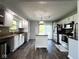 Well-lit kitchen with stainless appliances, tile backsplash, and center island at 3085 Oakmont Dr, Lapel, IN 46051