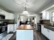Open kitchen features a center island, stainless appliances and flows into living area at 3085 Oakmont Dr, Lapel, IN 46051