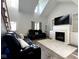 Cozy living room features a fireplace, vaulted ceilings, and comfortable seating at 3085 Oakmont Dr, Lapel, IN 46051