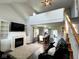 Open-concept living room features a fireplace, vaulted ceilings, and hardwood floors at 3085 Oakmont Dr, Lapel, IN 46051