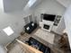 Upstairs view of living room with a fireplace and skylights at 3085 Oakmont Dr, Lapel, IN 46051