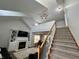 View of staircase leading to living space, featuring fireplace and built-ins at 3085 Oakmont Dr, Lapel, IN 46051
