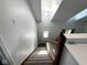 Carpeted stairs feature natural light and a skylight above the entry of the house at 3085 Oakmont Dr, Lapel, IN 46051